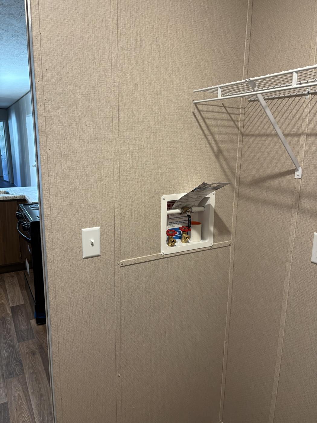 Laundry area with washer and dryer hookups