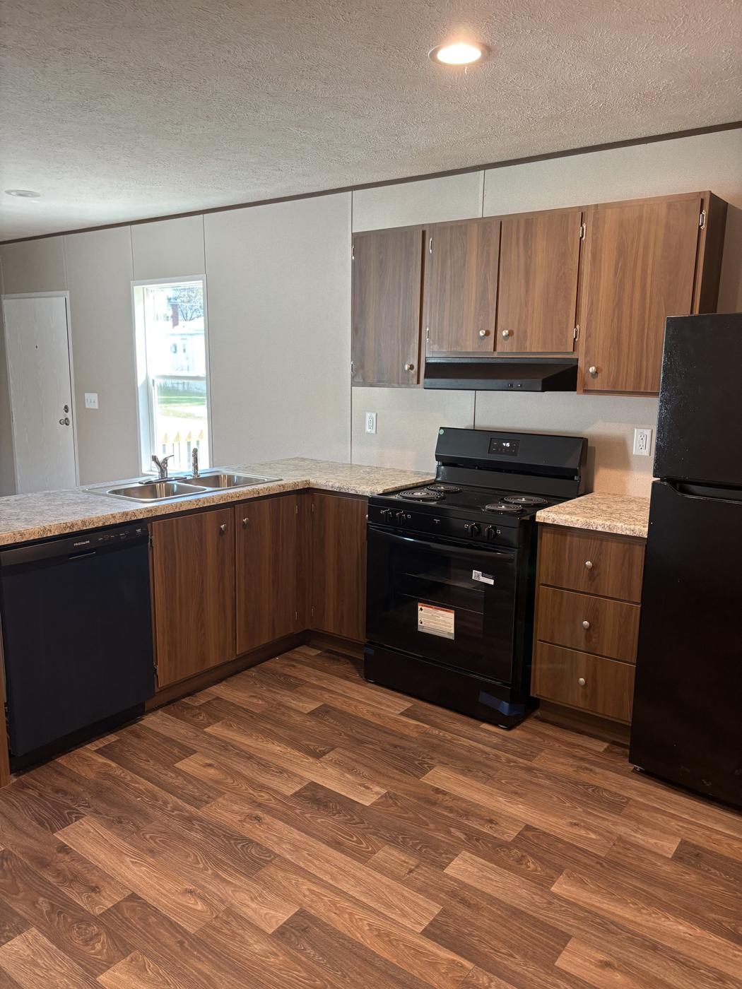 Kitchen with range and cabinets